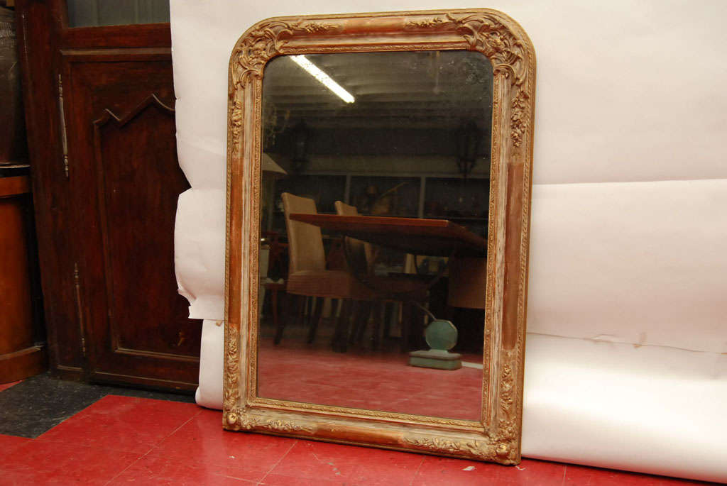 Gold gilt and wood classic Louis Phiippe mirror with decorative corner details.
Wonderful mirror for over the mantle, fireplace, dresser mirror, pier or console mirror.