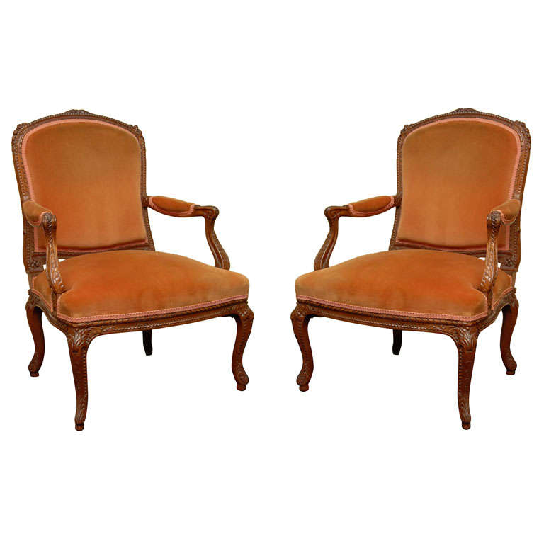 Pair of French Carved Fruitwood Armchairs For Sale
