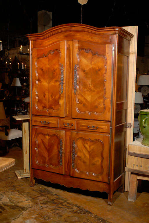 French four door armoire in fruitwood from Normandy.<br />
<br />
To see more items from Foxglove Antiques, please visit our website: www.foxgloveantiques.com