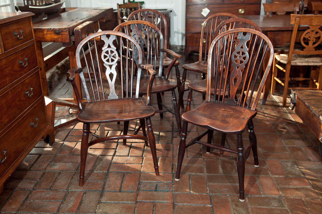 This is a gathered set of 2 arm chairs and 4 side chairs from the same period.  Very closely matched and with superb, well-worn patina, these chairs are comfortable for just about anyone--even Goldilocks would be hard-pressed to find a disagreeable