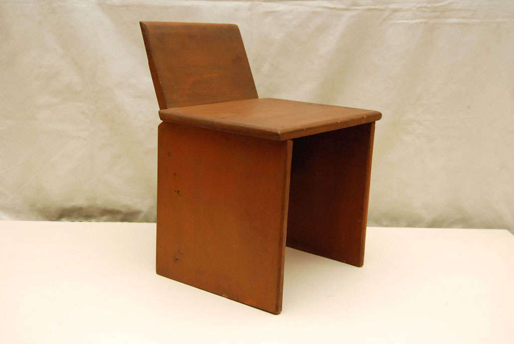 Usonian style childs chair with sled base. Simple Rietveld inspired design with solid pine panels. Retains its original finish.