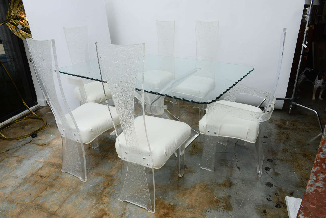 Fantastic and dramatic Mid-Century Lucite table and chairs. (Two-arm chairs and four sides). Beautifully bead blasted to simulate the look of ice.