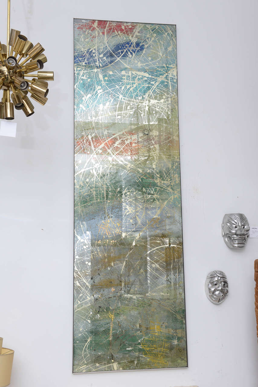 Pair of long custom reverse painted mirrored panels with a gradient of various colors, accented by 