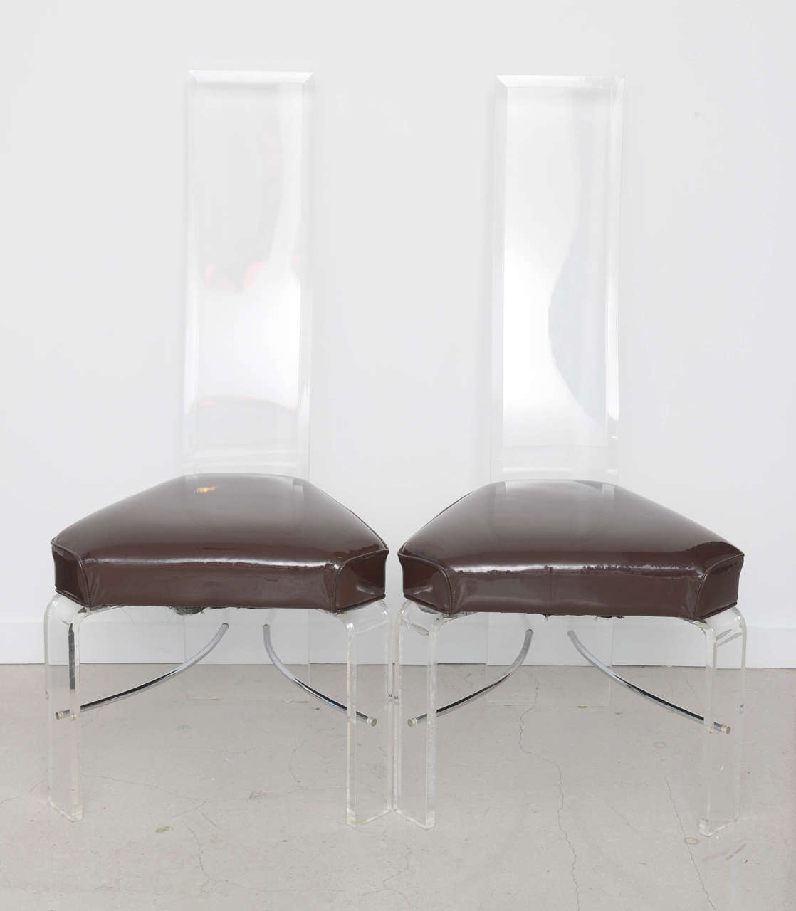 Set of four Lucite and chrome chairs by Alessandro Albrizzi.
