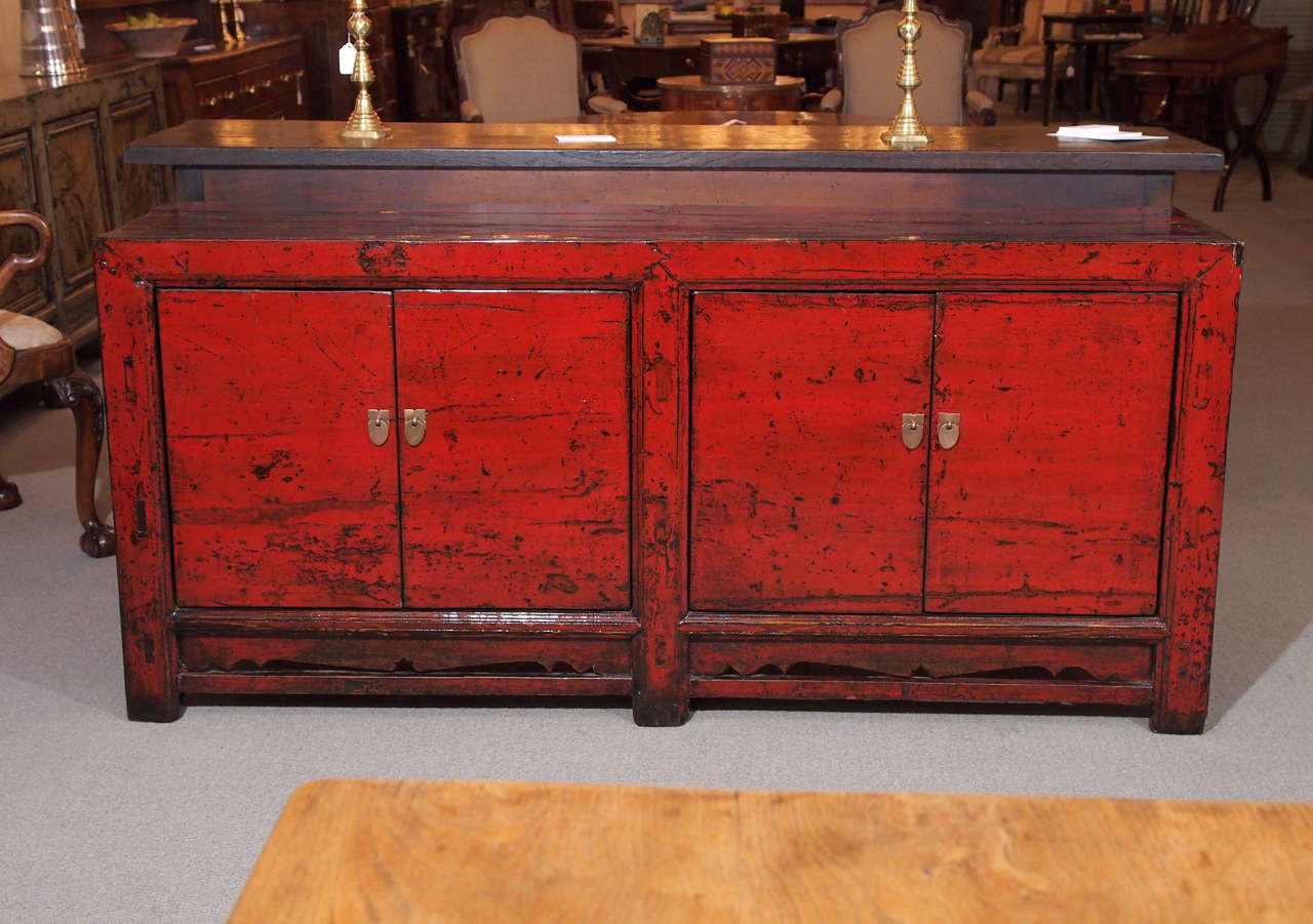 Antique Chinese red lacquer four-door sideboard.
