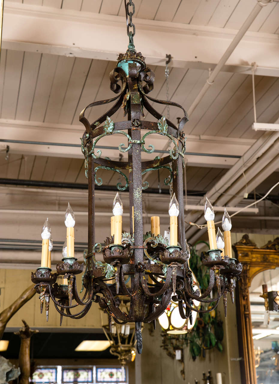 This beautiful wrought iron, hand-forged chandelier was salvaged from the Buena Vista Estate in Greenwich, CT. The Spanish style mansion was built in 1900. It originally hung in the exterior portico of the estate front entrance. This chandelier is