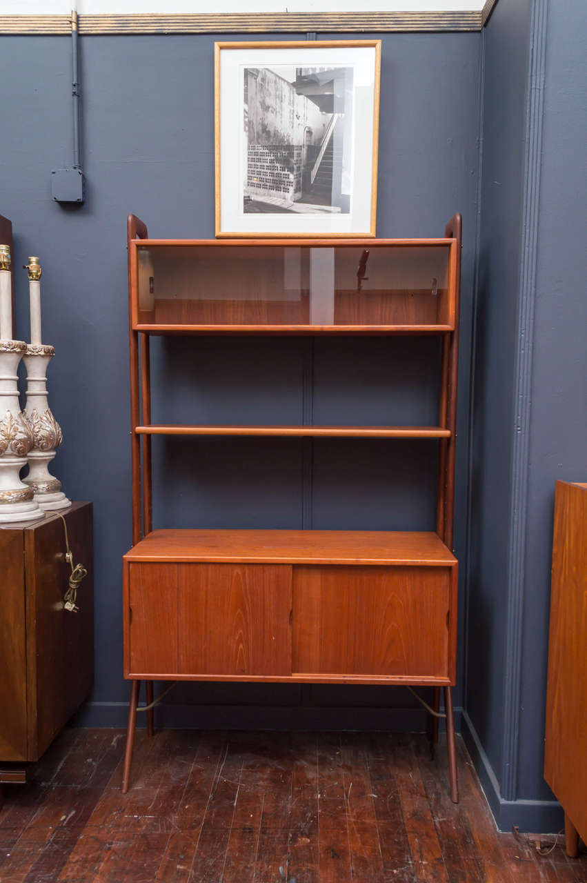 Free standing high quality construction teak book shelf or cabinet designed by Kurt Ostervig. Very good original condition with adjustable interior shelves.