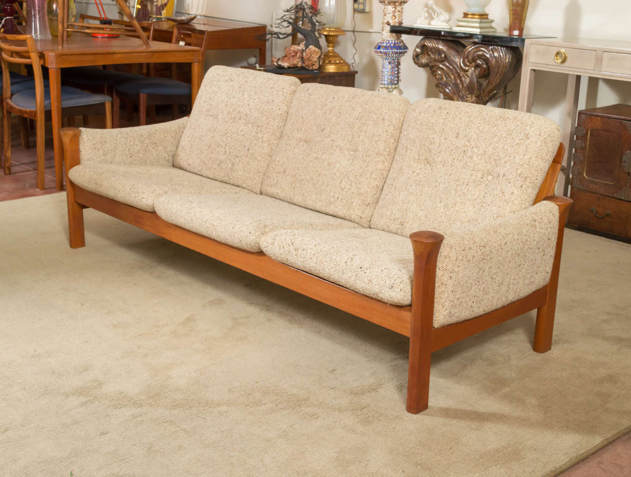 A circa 1970s Teak framed sofa, a Arne Vodder design for Cado. Set of six cushions, and arm padding in a Oatmeal color Wool fabric. Seat cushions are over steel springs that are still in great condition.