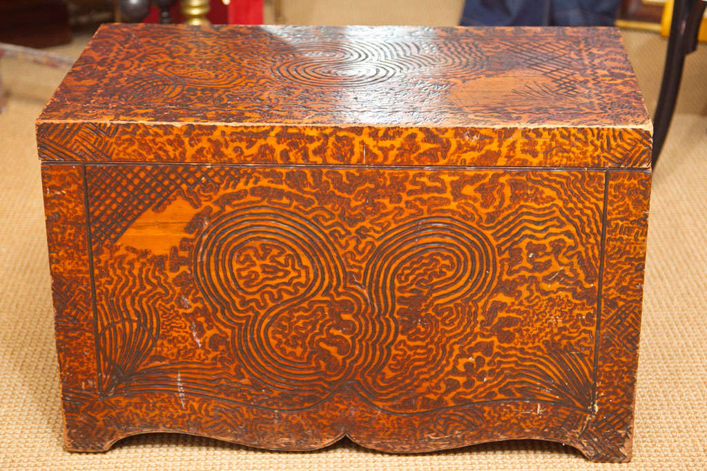 Wood burned (pyrography) chest with free-form design.