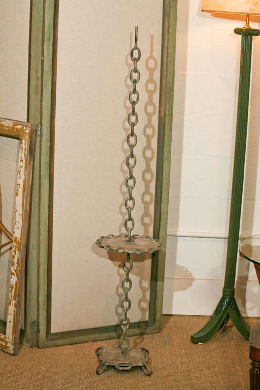 Here is an iron chain link floor lamp with a distressed patina. <br />
The painted finish on this lamp has been stripped to look like an oxidized metal. <br />
Great as is or can be refinished. Price includes wiring and a new socket.