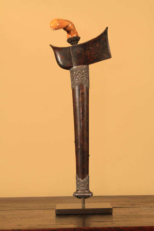 Indonesian keris (dagger) with large carved ivory hilt in the form of an abstract long-necked bird. With original bronze ring and straight blade. The pamor (blade) is folded and hand forged nickle and iron with a 'ripple of still water around the