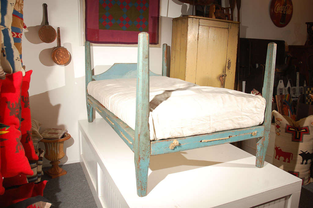 Fantastic original painted 19th century robin egg blue pencil post hired hands rope bed with a homespun mattress cover with custom-made mattress. The mattress is made of down and feather wrap with a foam insert. Great for a youth bed or guest bed in