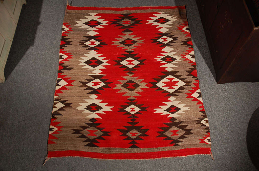 FANTASTIC NAVAJO INDIAN GEOMETRIC TRANSITIONAL WEAVING WITH WONDERFUL GEOMETRIC DESIGN AND VIBRANT COLORS.THIS RARE EARLY INDIAN WEAVING IS IN FANTASTIC CONDITION .THIS RUG IS A GREAT ADDITION TO ANY COLLECTION OF FOLK ART,INDIAN OR AMERICANA.