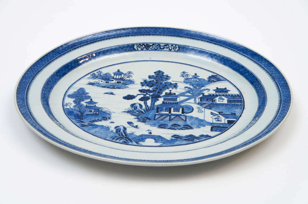 Large late 18th century Chinese Export porcelain platter of oval form in underglaze blue Nanking pattern.