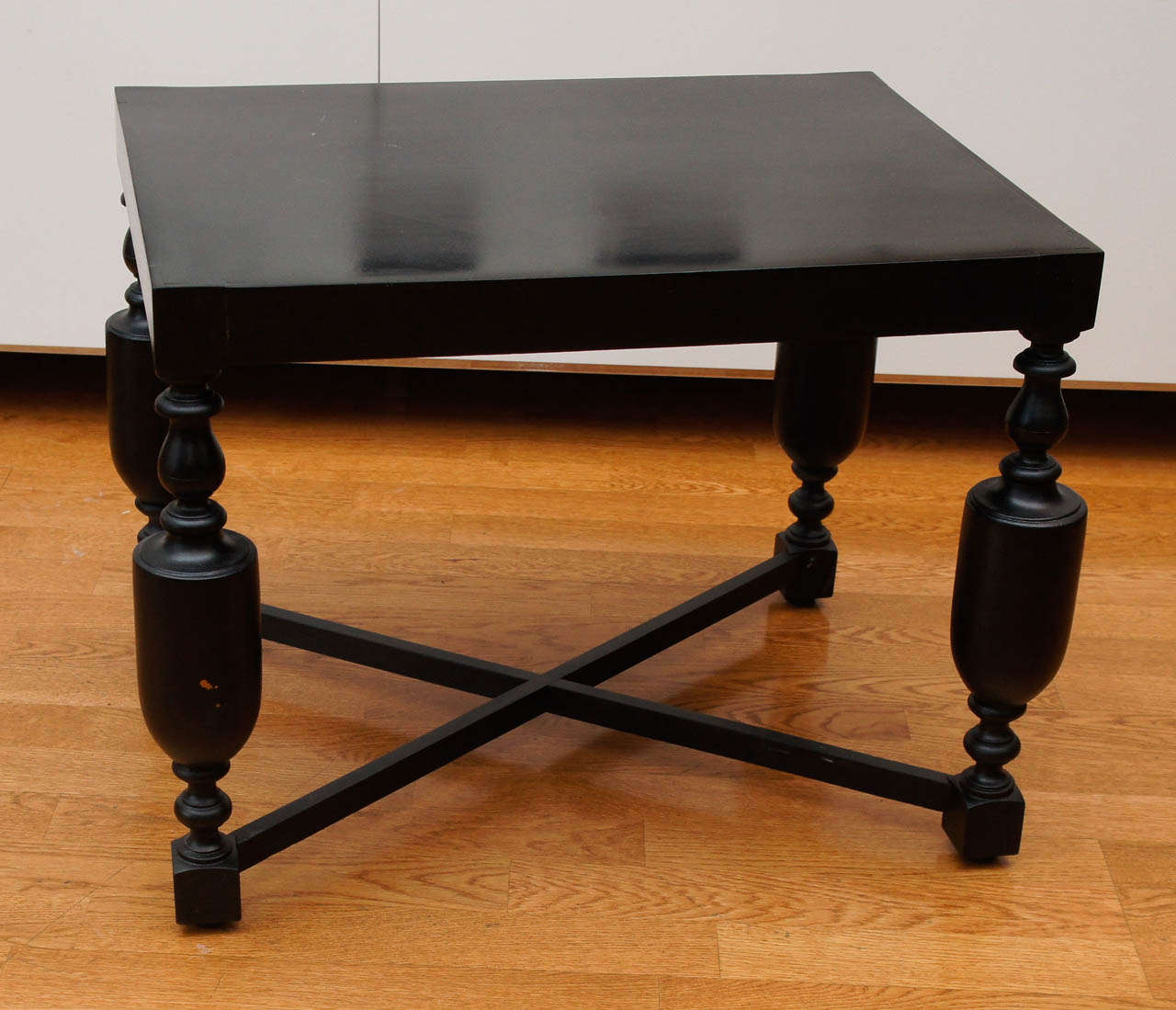 wood side table, newly finished in a dark ebony stain.
appealing, x-base stretcher, with turned legs.
