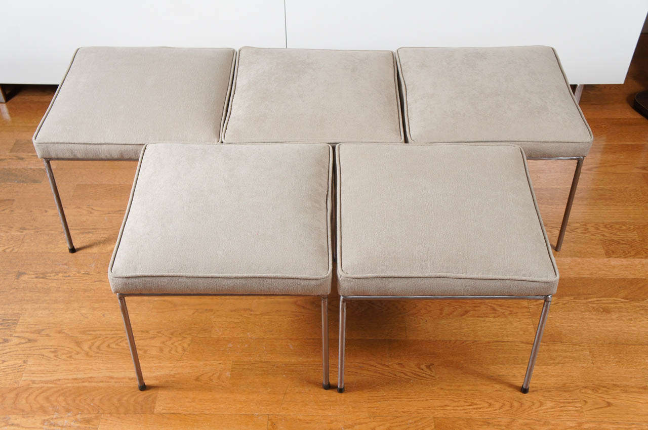 functional, mid century modern stool, on an iron welded frame with iron legs.
designed by Frederic Weinberg.
newly upholstered in a soft taupe, ultra suede fabric.
individually sold. creates interest when grouped together.