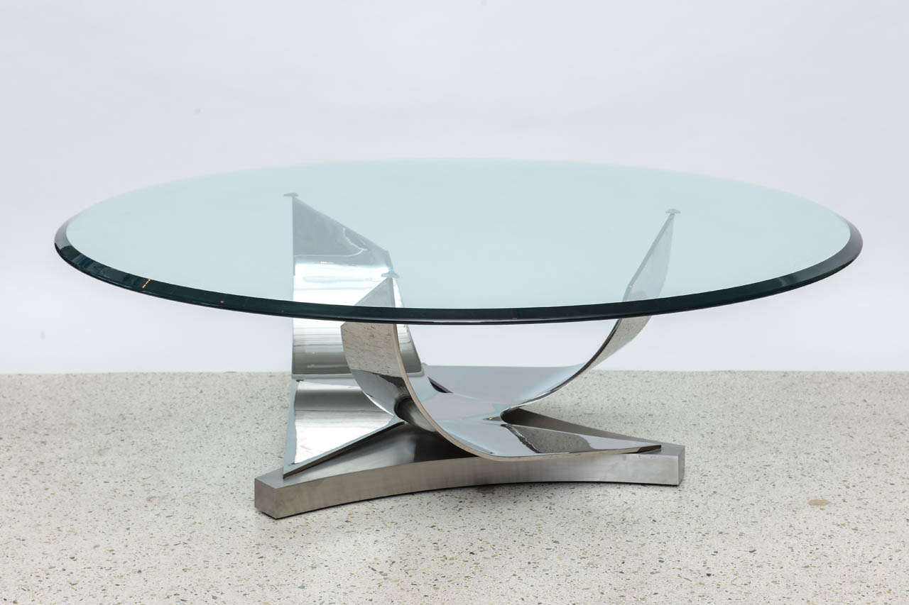 Ron Seff polished chrome and stainless steel glass top low table. Glass top 53.5 inches.