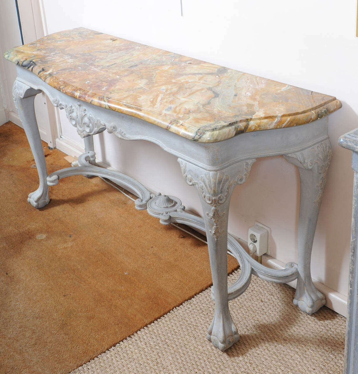 French mahogany console, patinated in blue/grey.
Marble top, with a restauration
