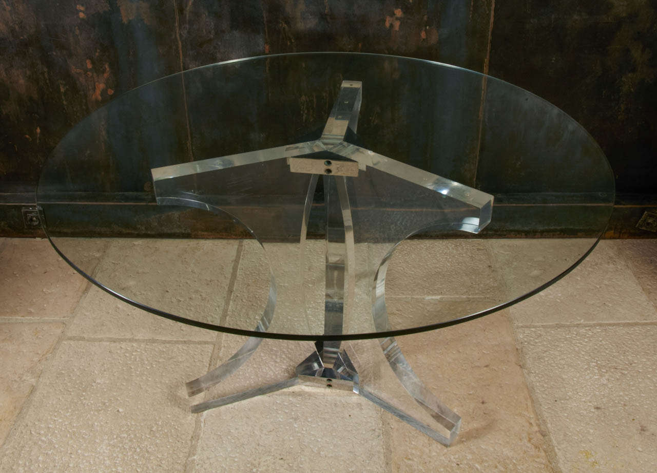 All in transparency 1970's plexiglass dining table with a plexiglass and chrome metal base and a glass top. French design.