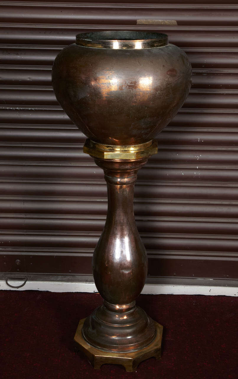 a big urn on its base?red copper and yellow brass,nineteen century