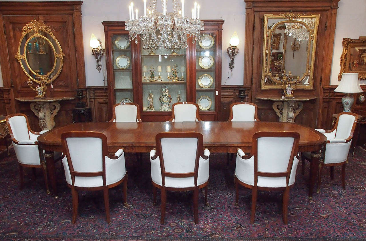 Table has four leaves: three measure 19 1/2 inches each, one measures 20 1/4 inches.
The chairs measure 38 1/2