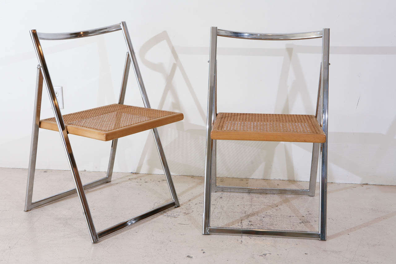 Set of 4 Italian folding chrome and cane chairs.