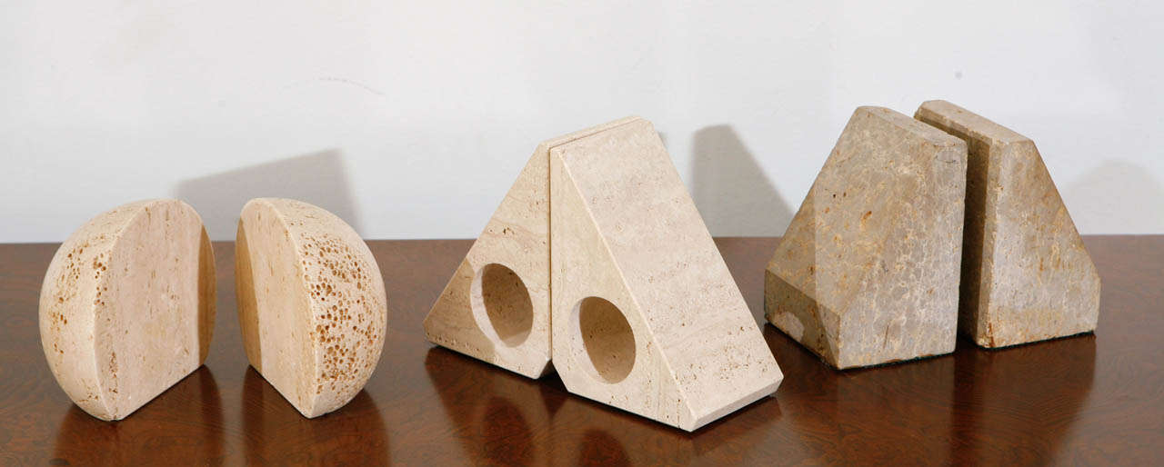 Collection of Travertine Book Ends. Priced Left to Right: $285, $285, $285.
