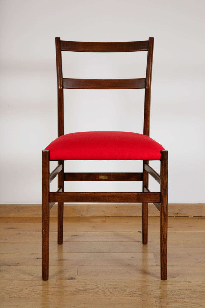 Early 1950s, for Cassina
Ash frame, seat re-upholstered in scarlet silk
With original 'Cassina' label to 6 of the chairs