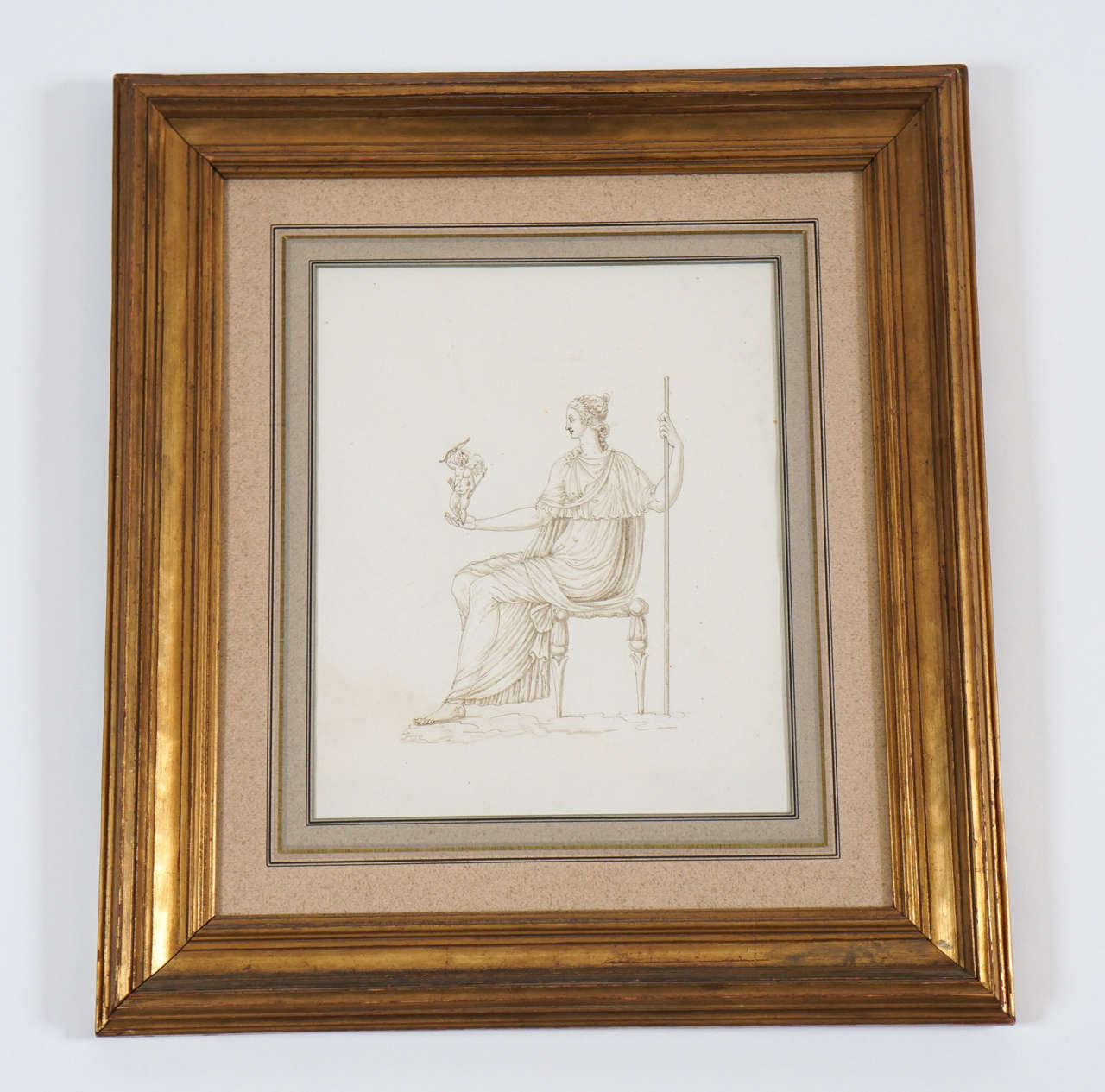 Italian neoclassical sepia drawing of the Roman goddess Venus seated with cupid in right palm. Professionally archival mounted in burnished gilt frame with compound French matting by J. Pocker & Son. Image sight measurements are 10.25