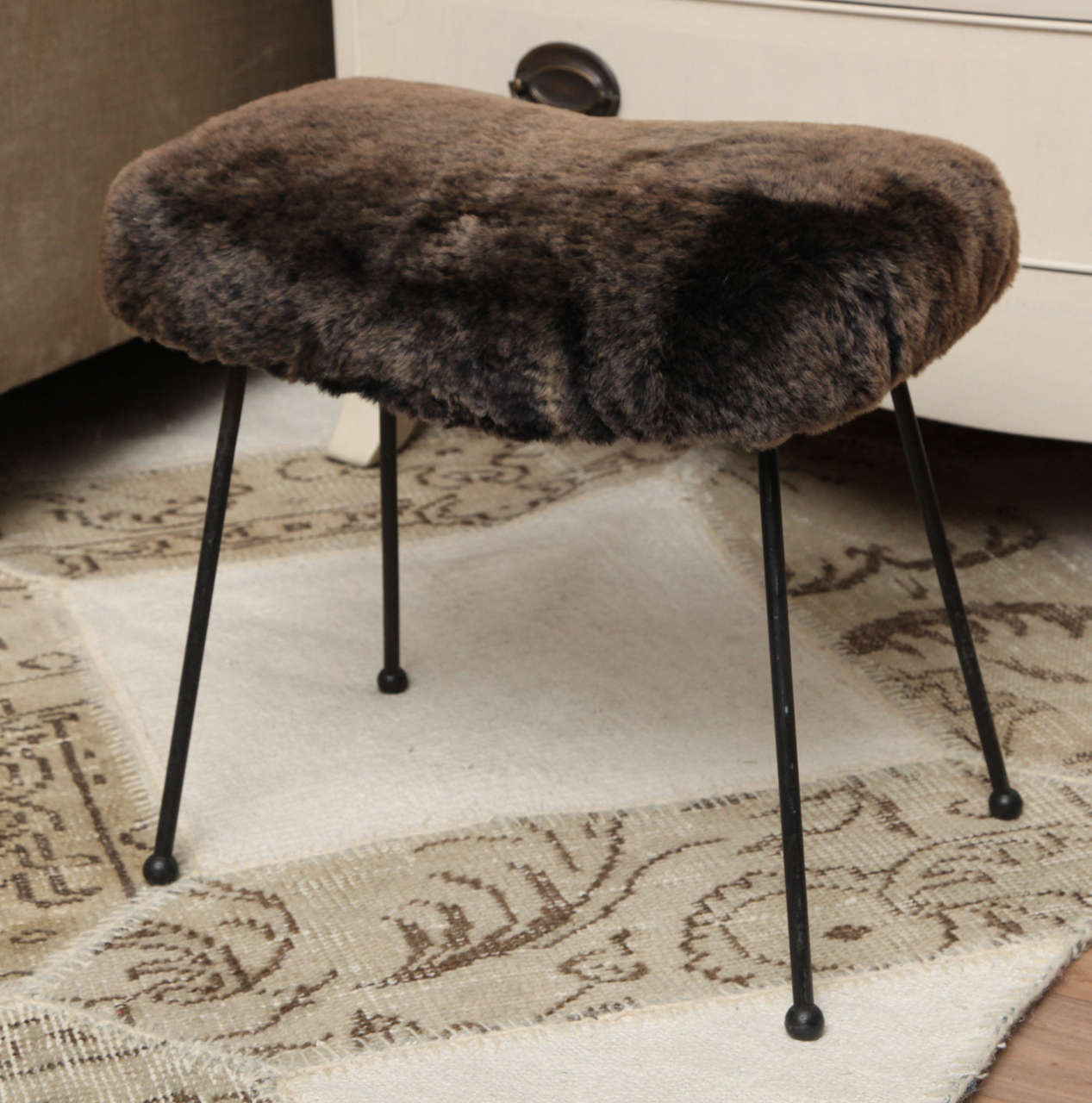 Midcentury iron footstool reupholstered with brown rex rabbit fur