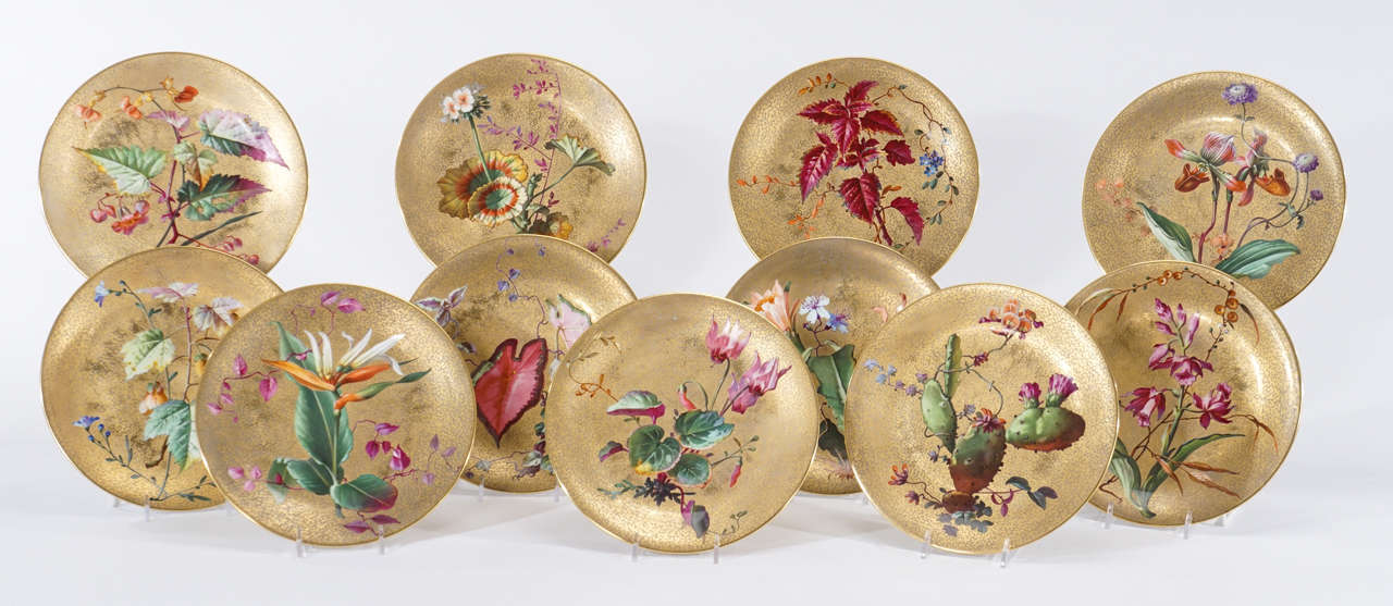 This is one of the most amazing and unique sets of hand-painted cabinet plates with exotic flowers in my extensive inventory. Each plate is uniquely painted in the Aesthetic Movement style, with a rare specimen not usually depicted on cabinet