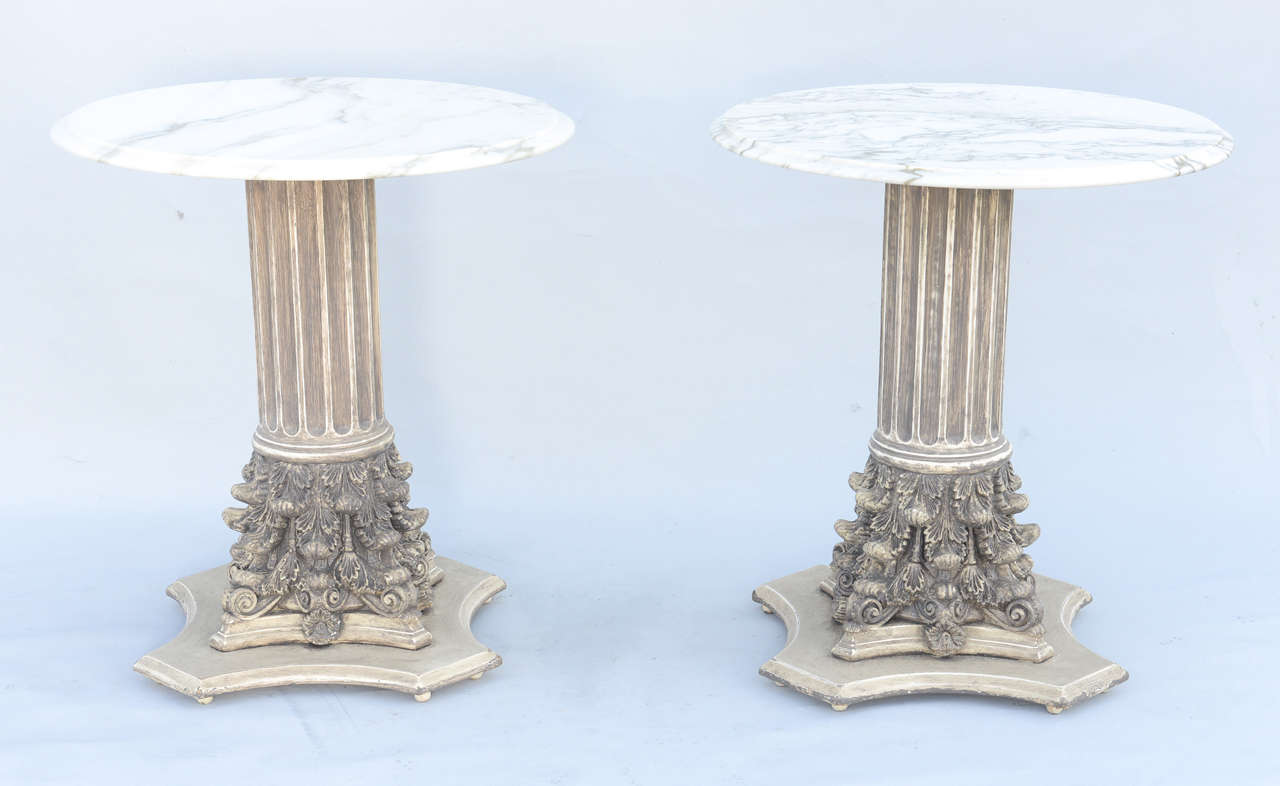 Pair of end tables, each having a round top of marble, on fluted column-form table bases with painted finish, ending in Corinthian capital plinths, on concave foot. By Lincoln Furniture Company, Asbury Park, New Jersey.

Stock ID: D3456