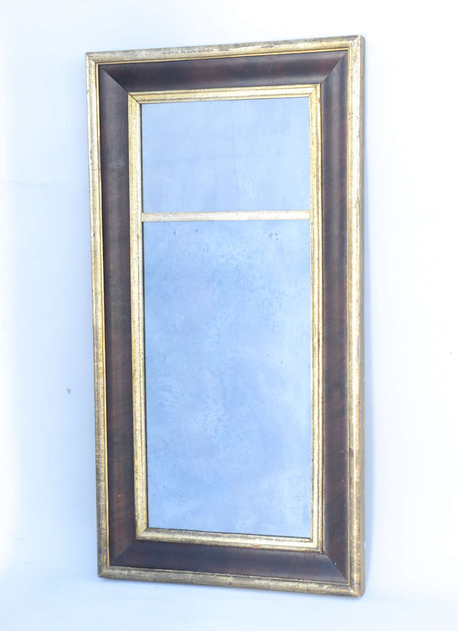 Mirror, having divided plates of distressed mirror, in a molded rectangular frame, with painted convex border trimmed with silvergilt.