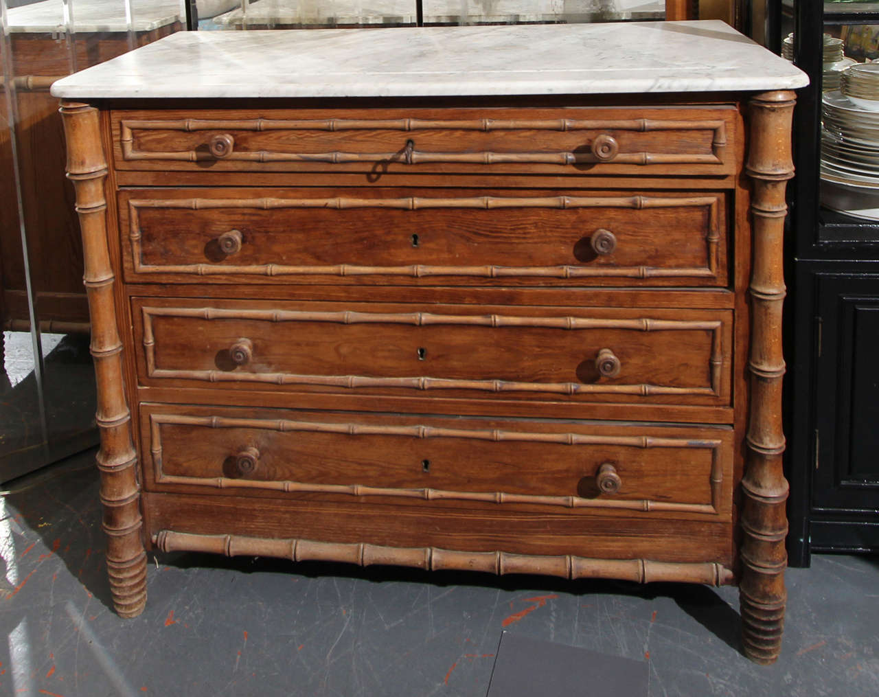 Marble-top faux bamboo chest with key.