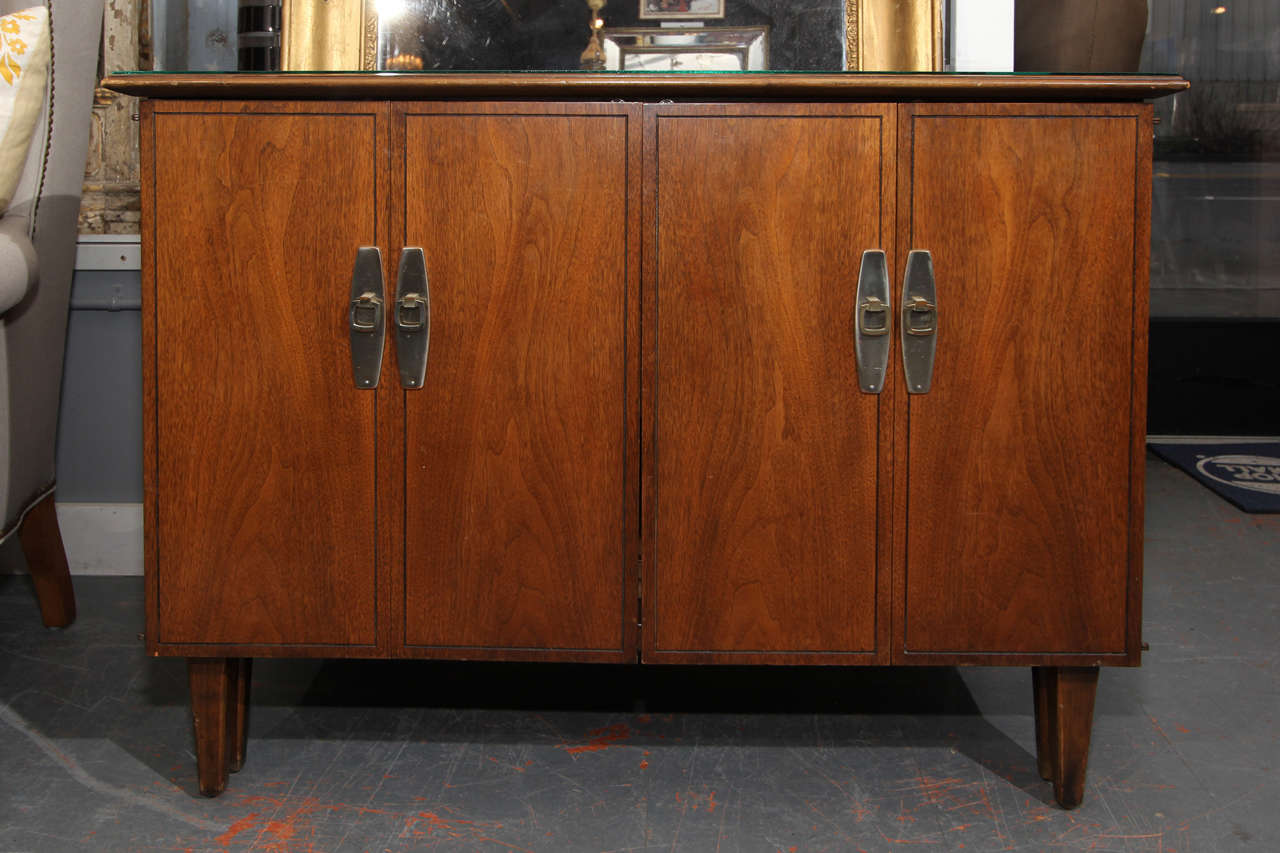 Mid-Century American buffet that opens to hold one, two or all three leaves. Leaves store within buffet or sideboard and there is a generous drawer to hold linens and tableware. Perfect for small space living or the perfect extra table for extra