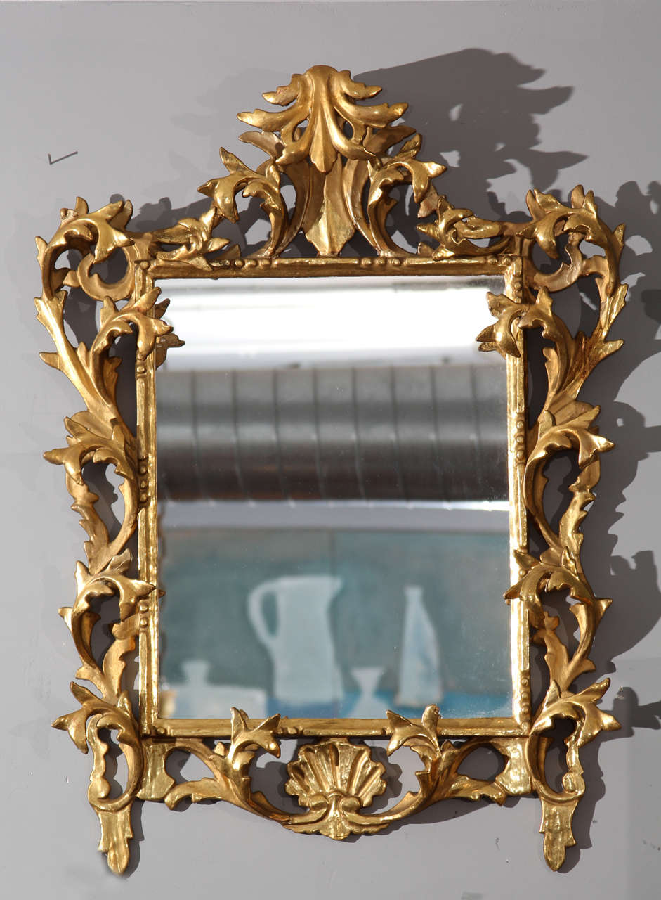 Carved wood gilt mirror.