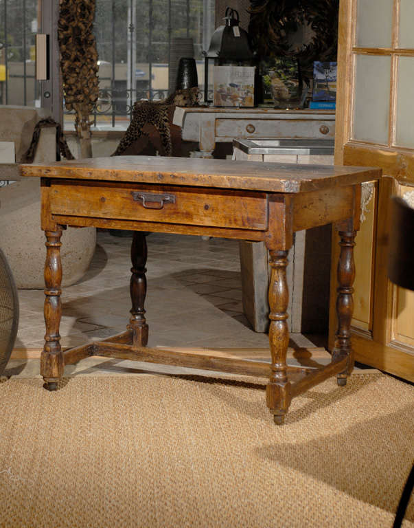 19th Century one drawer writing desk with bobbin- turned block legs and stretcher.