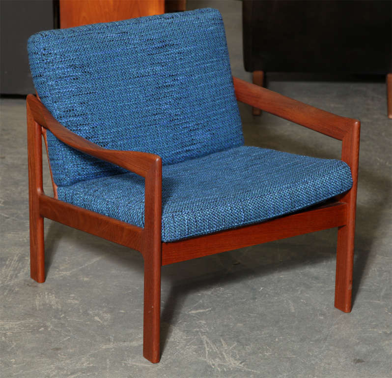 Rare and Stunning pair of Teak and Blue Armchairs by Illum Wikkelso with hand carved solid wood frames.  Features a ladderback and original blue cushions in phenomenal condition.

Also available from the series: Highback Loungechair and 3-Seater