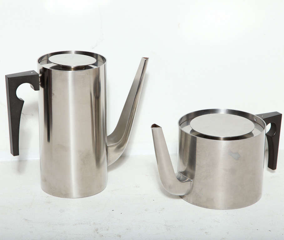 Cylinda Line Original Tea and Coffee Service by Arne 
Jacobsen for Stelton.  Brushed steel body with plastic handles.  Excellent Condition.