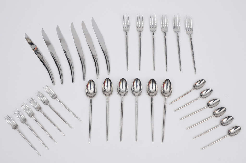 Philippe Stark  5 piece place  sets of  flatware manufactured by Sasaki.Setting for six
No longer in production.
knife-10