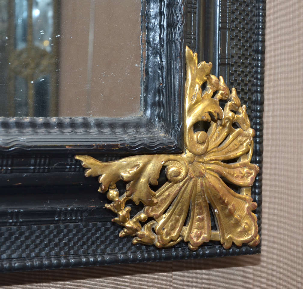 French A Louis XIV Gilded & Ebonised Mirror