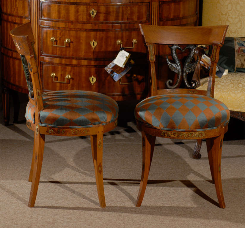 A pair of beech side chairs with ebonized back spats. 
