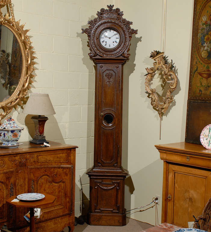 A French oak tall case clock with basket crest.

William word fine antiques: Atlanta's source for antique interiors since 1956.