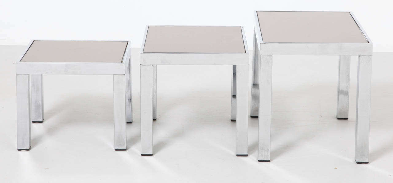 Nesting tables by Belgochrom, 
Belgium c1970s with mirrorglass top and metal-chrome base.
