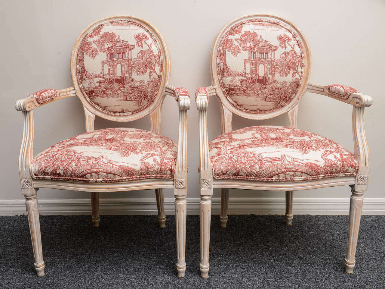 Vintage Louis XVI Style armchairs. Very comfortable and sturdy. Upholstered in a red pagoda design fabric.