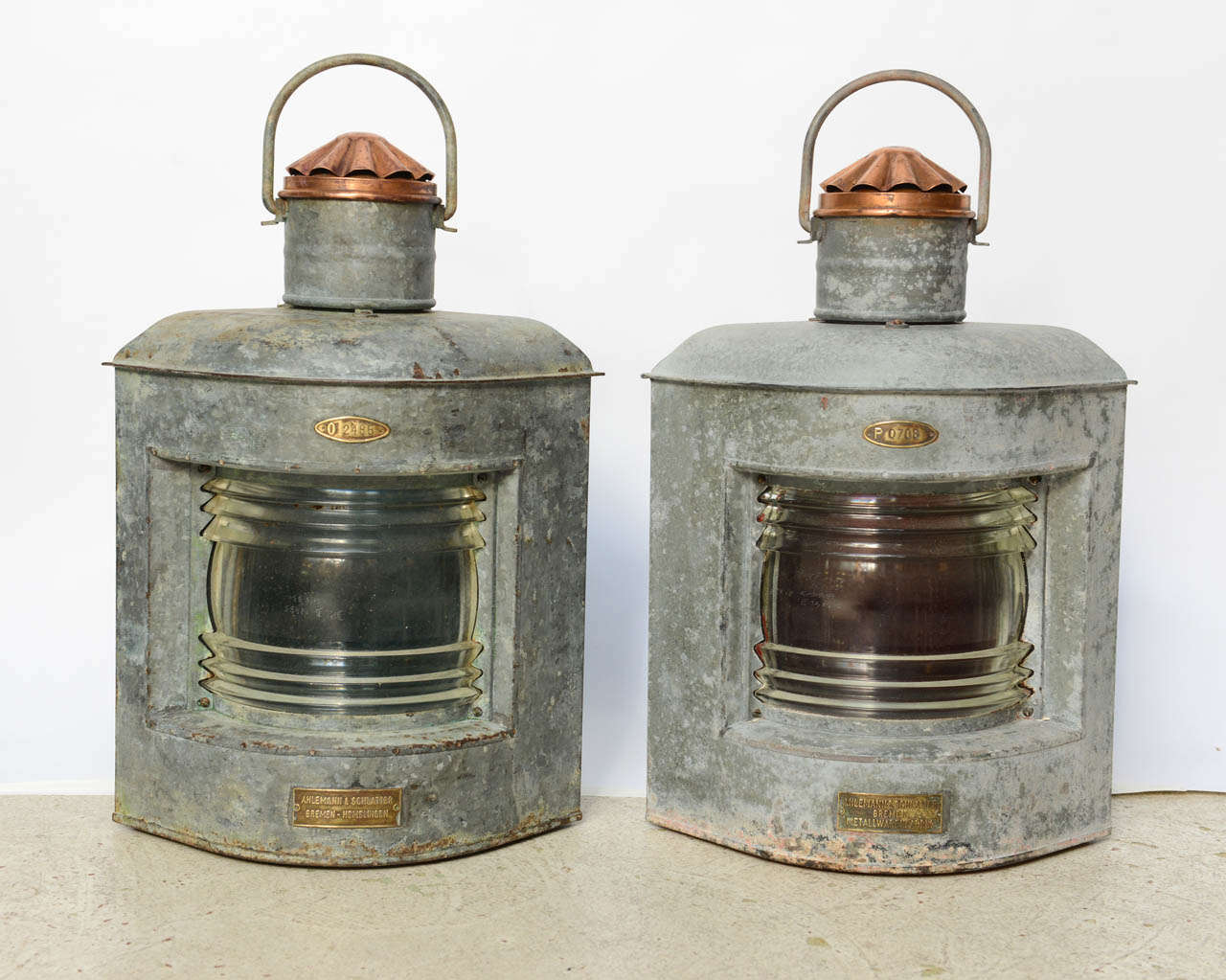 Unique pair of galvanized metal and copper ship's lanterns with original brass plaque serial numbers.  Made by Ahlemann & Schlatter.