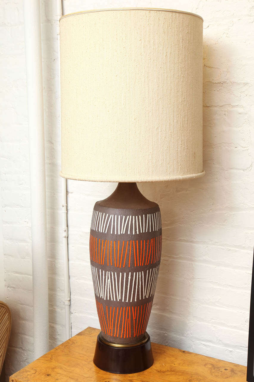 Large brown ceramic lamp with orange and white geometric stripe design c. 1960