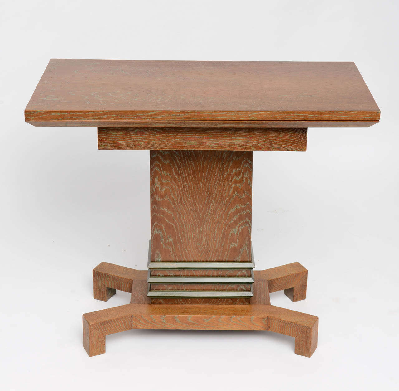 Very high-end Art Deco cubist design. A light and subtle turquoise ceruse on this hight quality solid oak console or side table.  The top of the table slides around and opens up to become a game table. Chips compartments are under the top which is