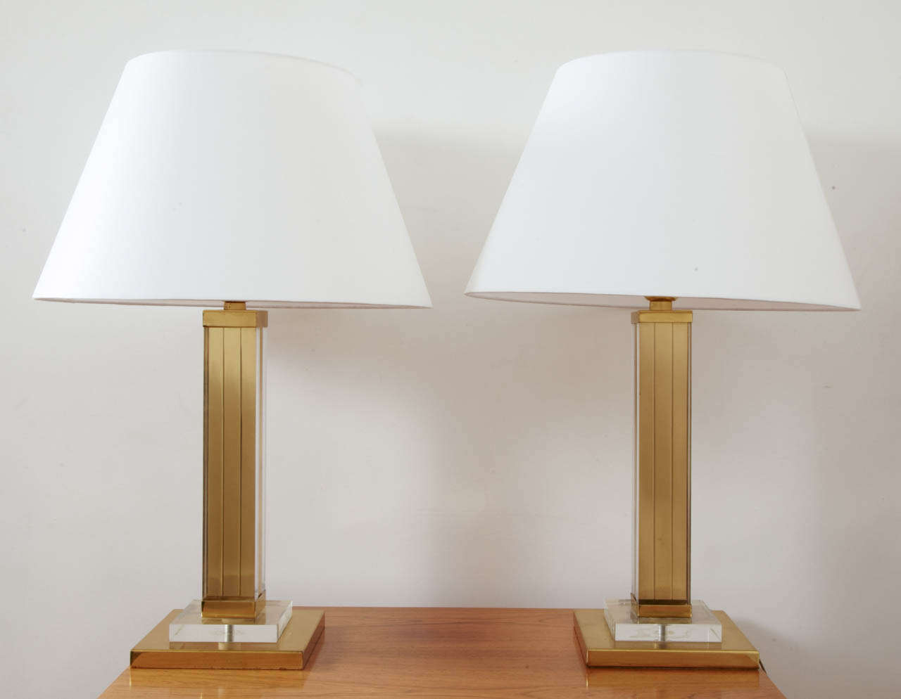 Pair of gilt brass and lucite square table lamps, France, 1970’s.

