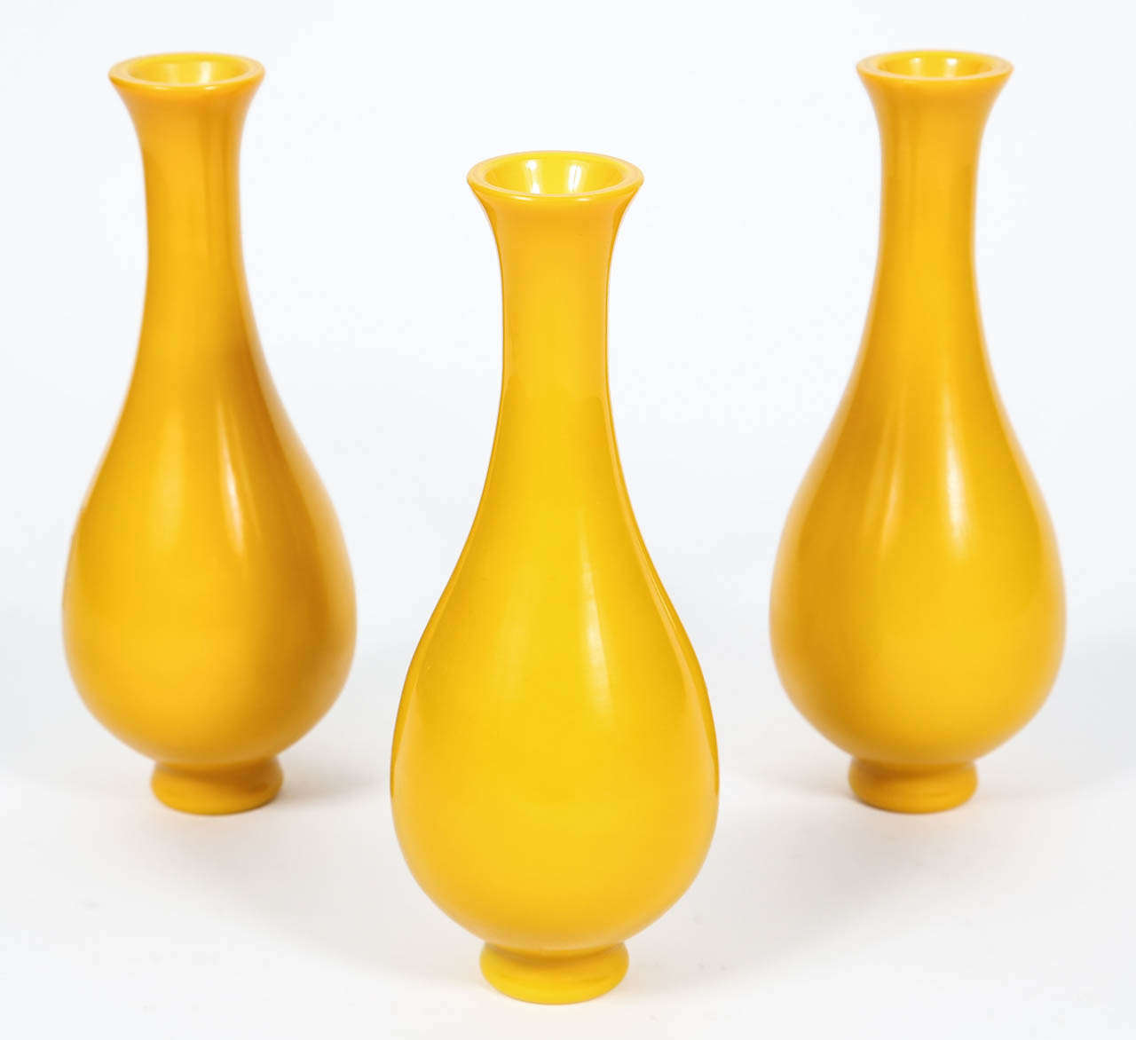 Set of three large yellow Peking glasses vases.